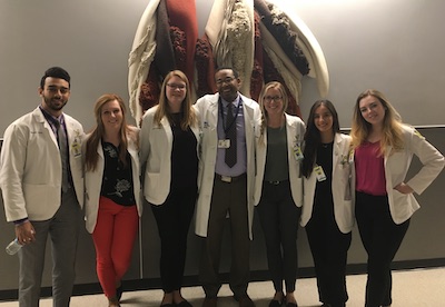 Dr. Dennis Parker with students at Detroit Receiving
