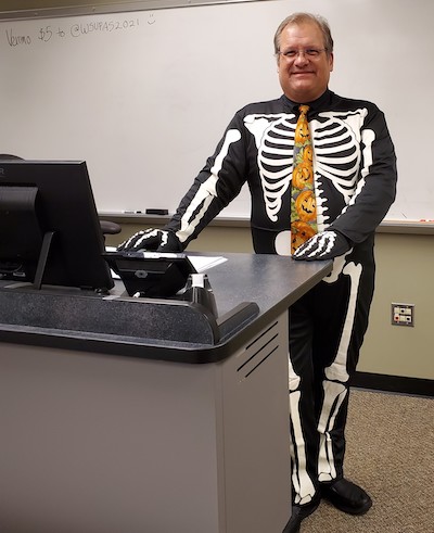 Dr. Phil Pokorski dressed in a skeleton costume