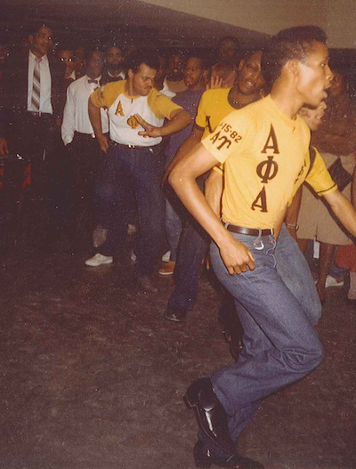 Charles Washington step dancing with Alpha Phi Alpha brothers