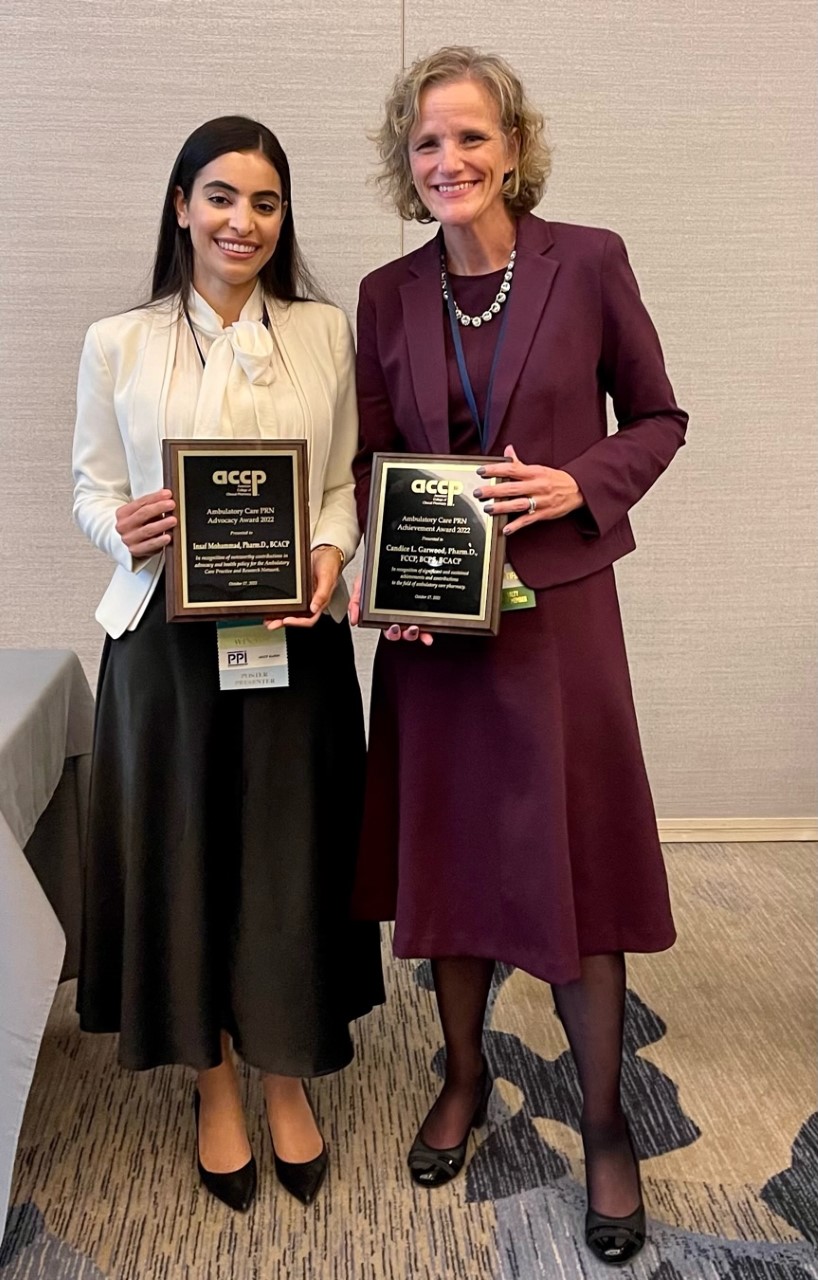 Dr. Insaf Mohammad and Dr. Candice Garwood with their award plaques.
