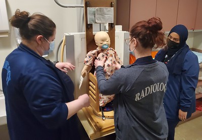 Radiologic Technology students learn how to x-ray a baby.